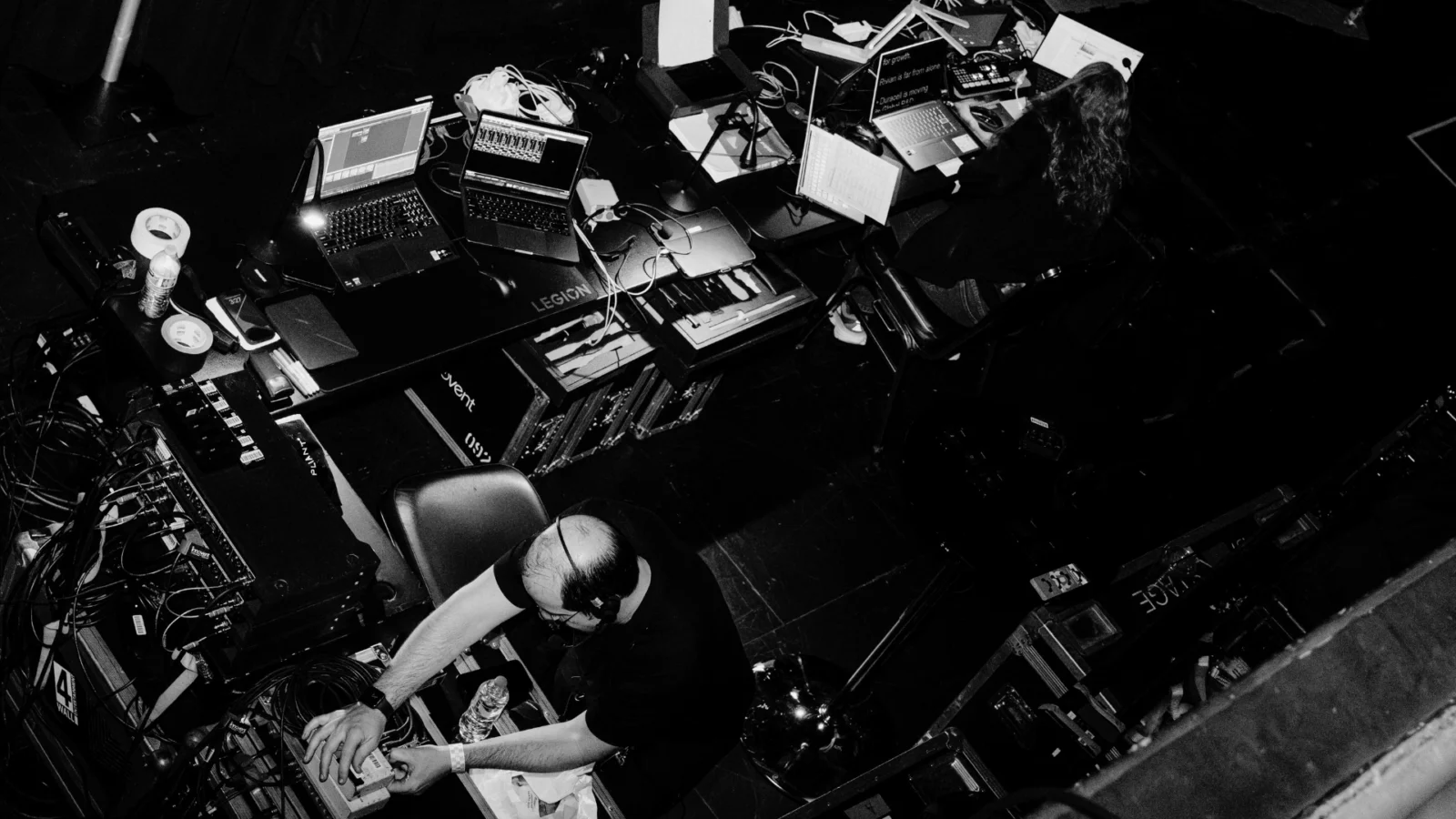 AV production team managing large conference show control and technical coordination for multi-room event