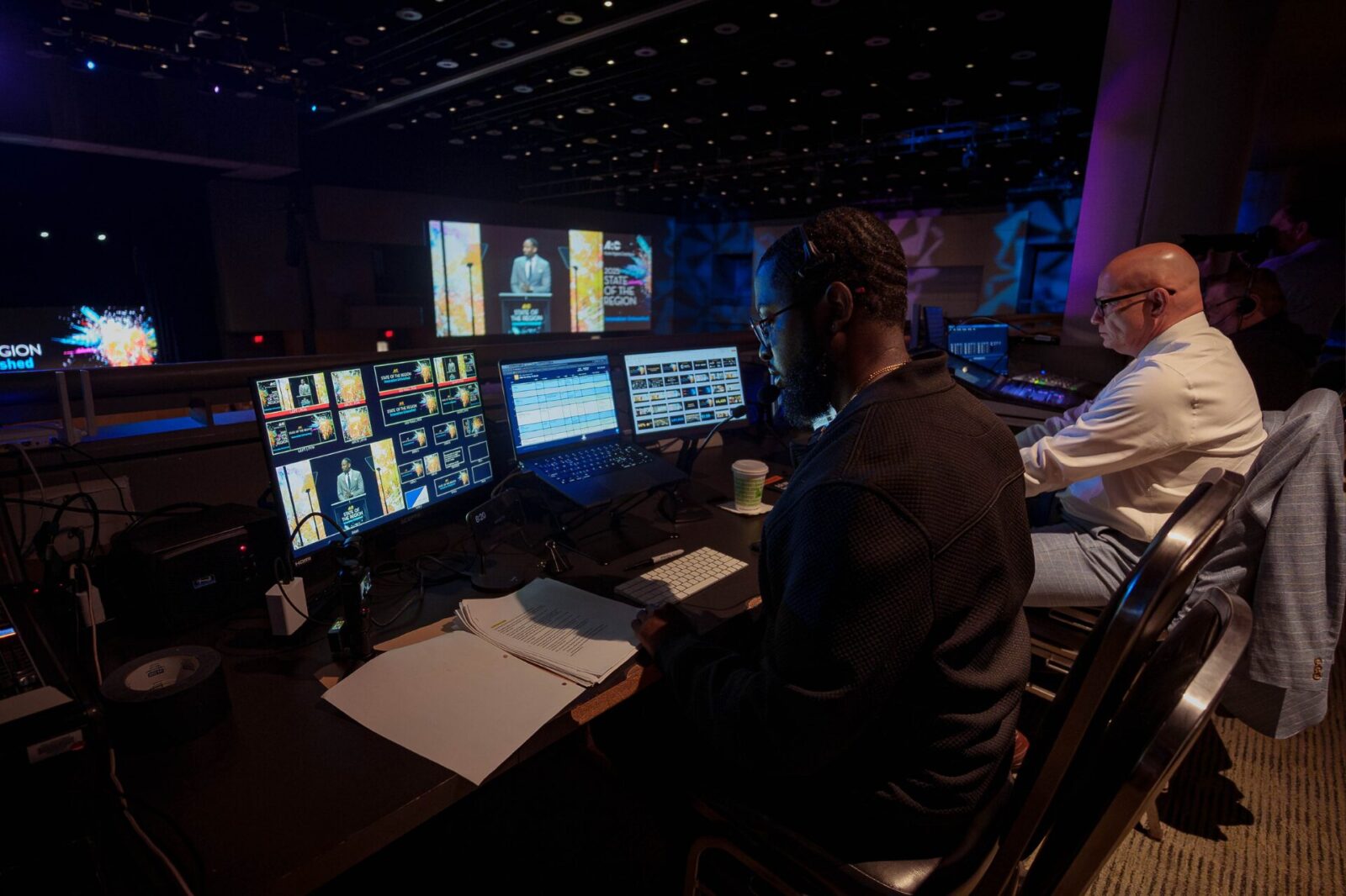 Behind the Scenes AV Production Technician | Innovent Technologies AV technician managing live event production behind the scenes at Atlanta Regional Commission State of the Region