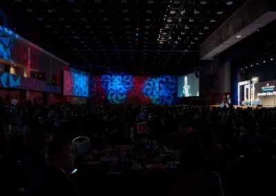 Large-scale general session at ARC State of the Region 2025 featuring LED stage design, projection, and architectural lighting in an Atlanta conference ballroom