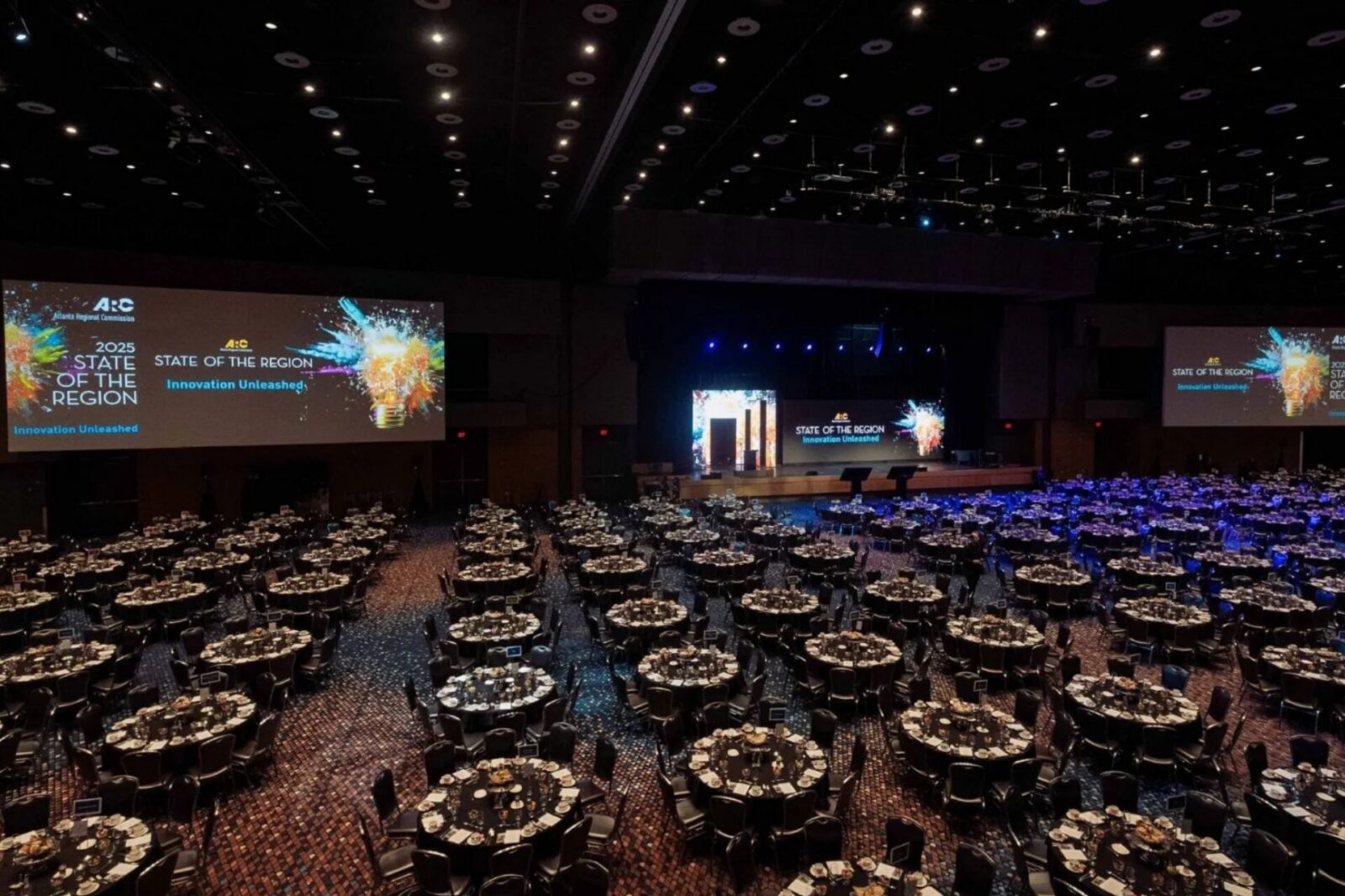 Large-Scale Ballroom AV Production Atlanta | Innovent Technologies Large ballroom general session setup with LED stage, projection screens, and full AV production by Innovent Technologies in Atlanta