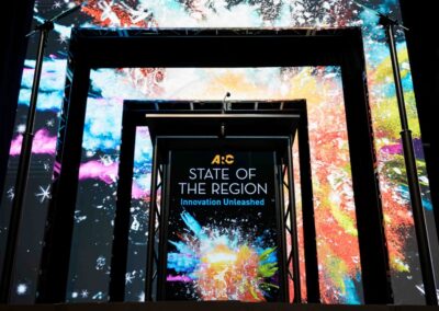 Custom LED scenic portal structure for Atlanta Regional Commission State of the Region stage design by Innovent Technologies
