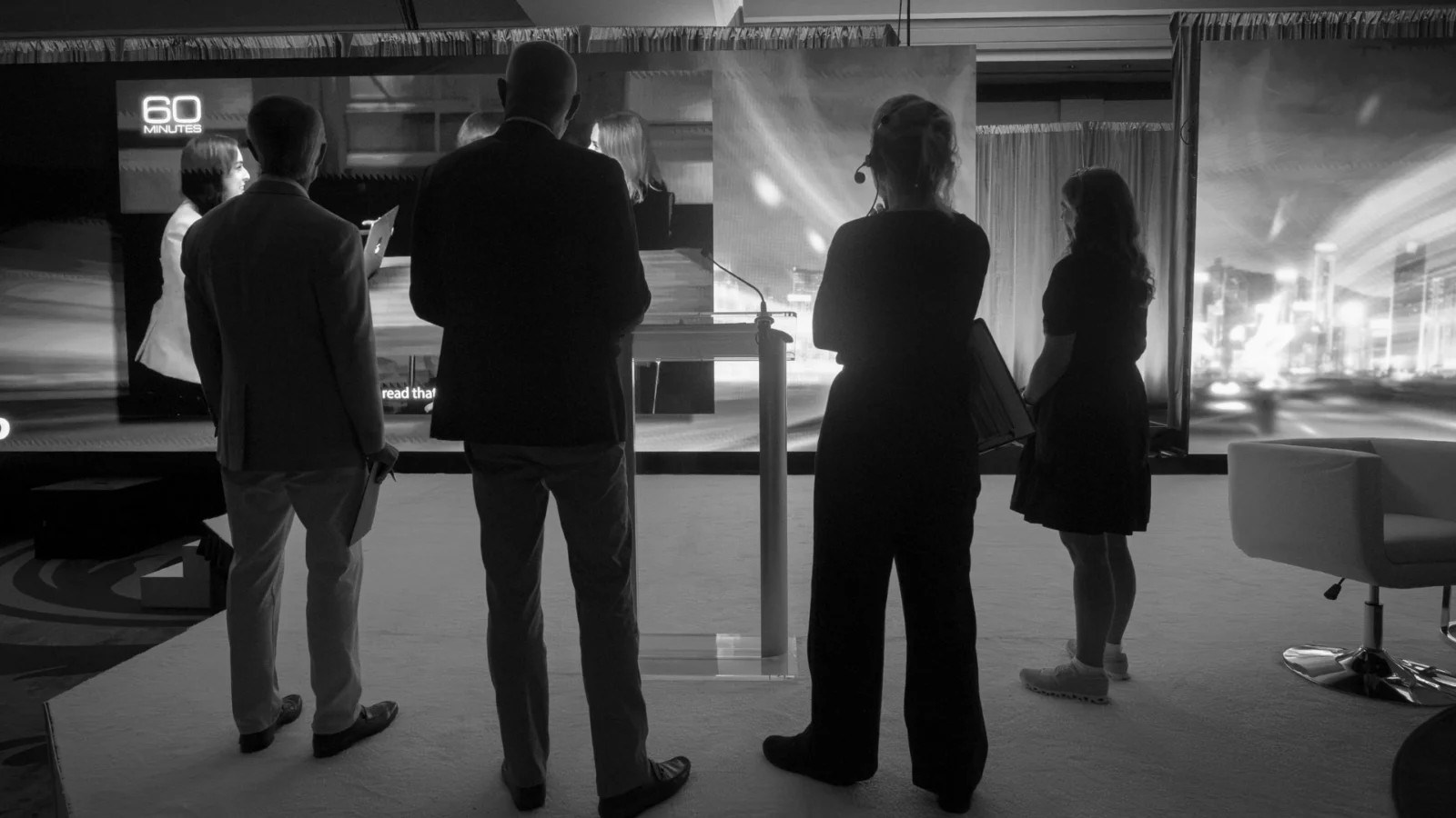 Corporate event production team evaluating LED stage setup illustrating AV vendor versus production partner planning