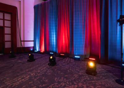 Professional stage lighting design with color wash uplighting for corporate event production