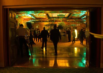 Corporate event entrance hallway with immersive lighting design and attendee arrival experience