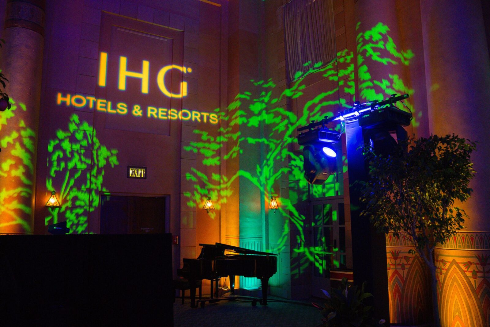 IHG Hotels & Resorts logo projection with custom gobo lighting and green scenic wash at The Fox Theatre event produced by Innovent Technologies