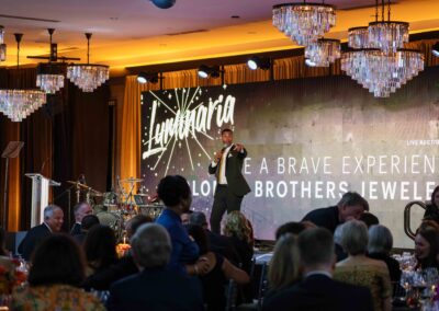 Live auction moment at Piedmont Healthcare Luminaria gala featuring LED video wall, stage lighting, and fundraising production by Innovent Technologies