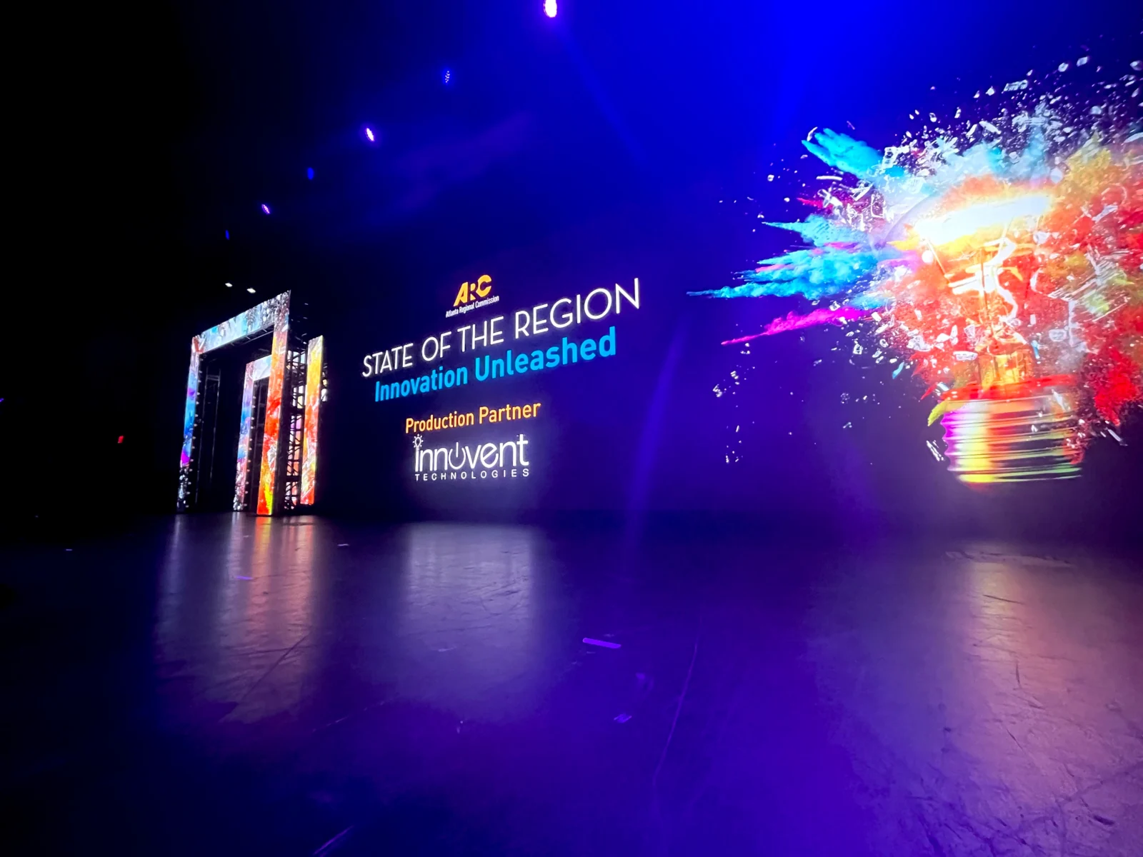 Atlanta Regional Commission State of the Region stage with large LED video wall, custom scenic portal, and lighting design by Innovent Technologies