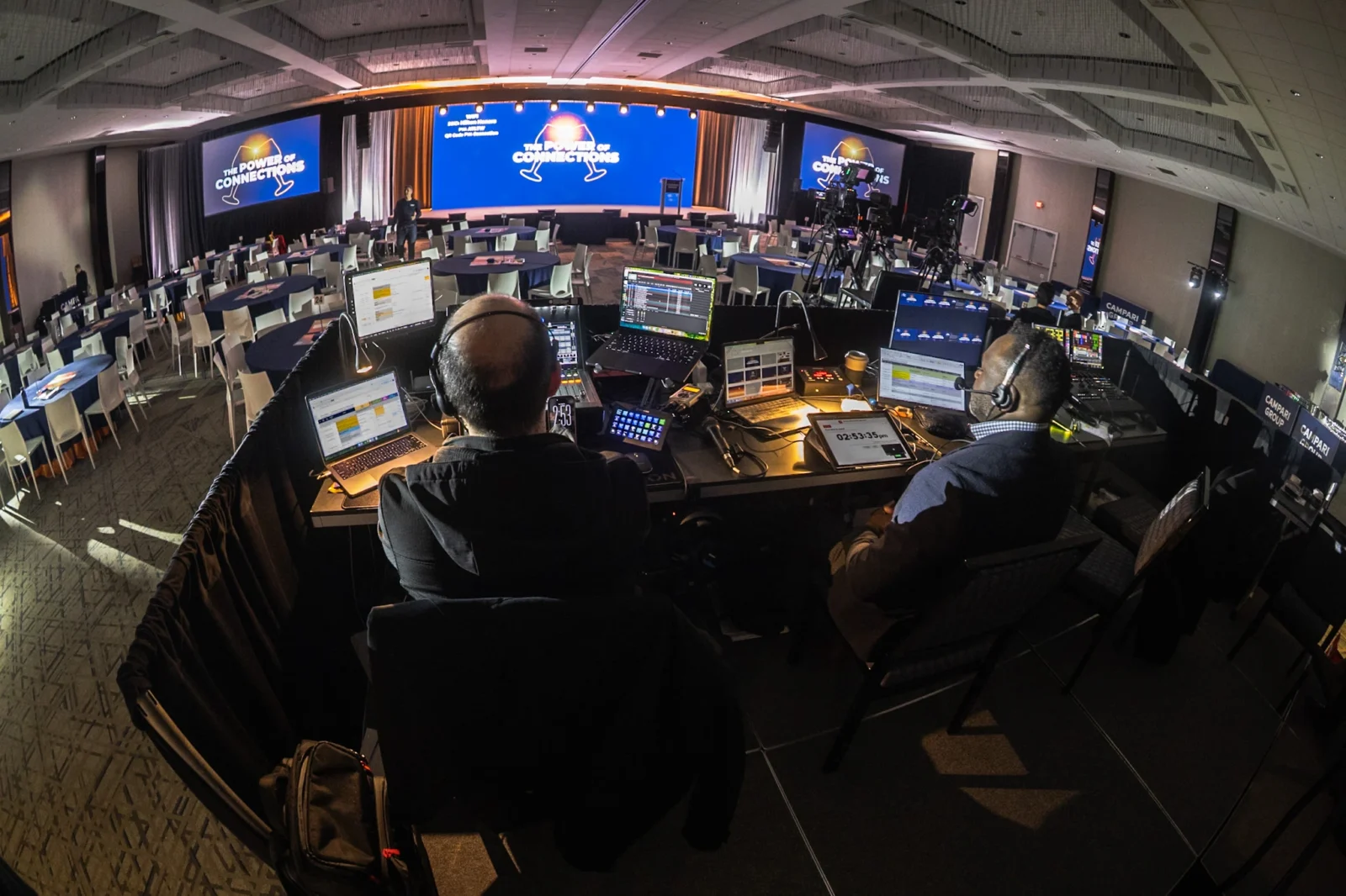 Live event control booth with production team managing video switching, audio, and show cues for Campari Group general session in Atlanta by Innovent Technologies