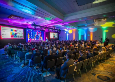 Large corporate event in Atlanta with LED video screens, stage lighting design, and AV production by Innovent Technologies