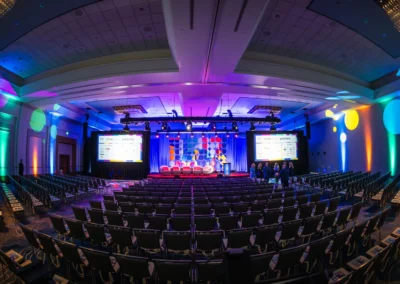 Ballroom event setup for Cumberland Community Meeting in Atlanta with stage design, LED backdrop, projection screens, and lighting by Innovent Technologies