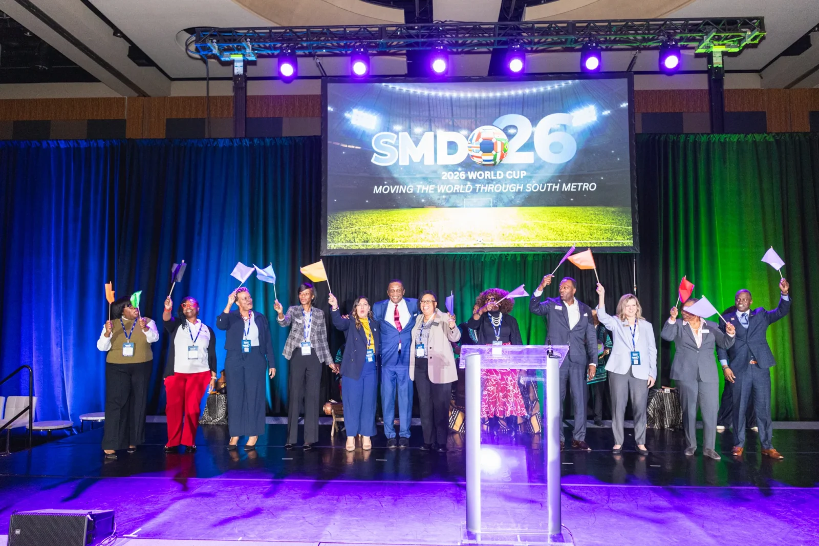 Group presentation on stage with LED screen, lighting design, and corporate event production by Innovent Technologies