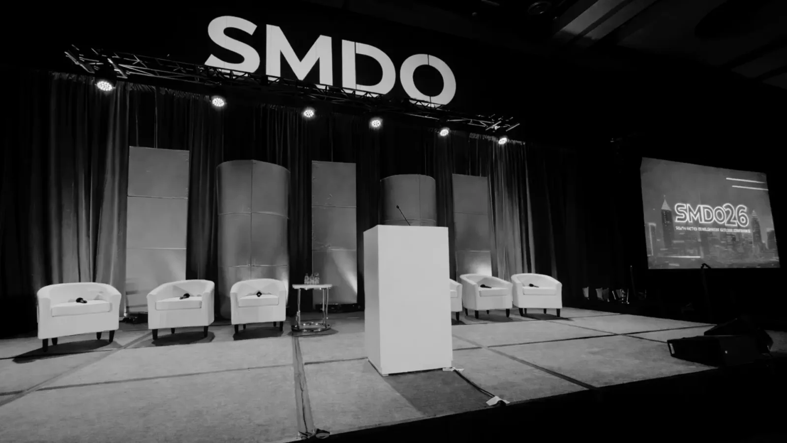 South Metro Development Outlook stage production at Georgia International Convention Center with projection screens and panel setup