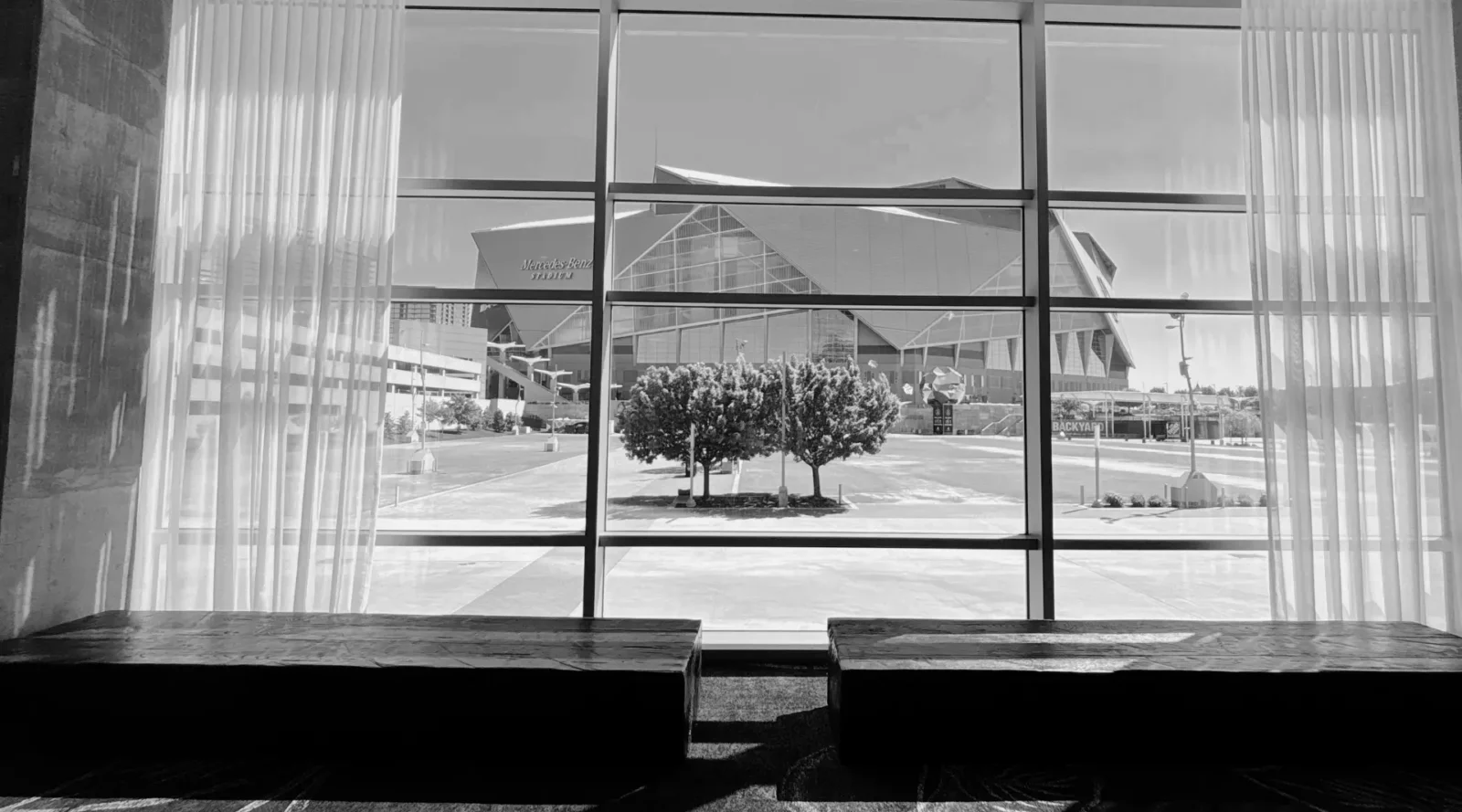 View of Mercedes-Benz Stadium from interior window showcasing Atlanta conference and event venues