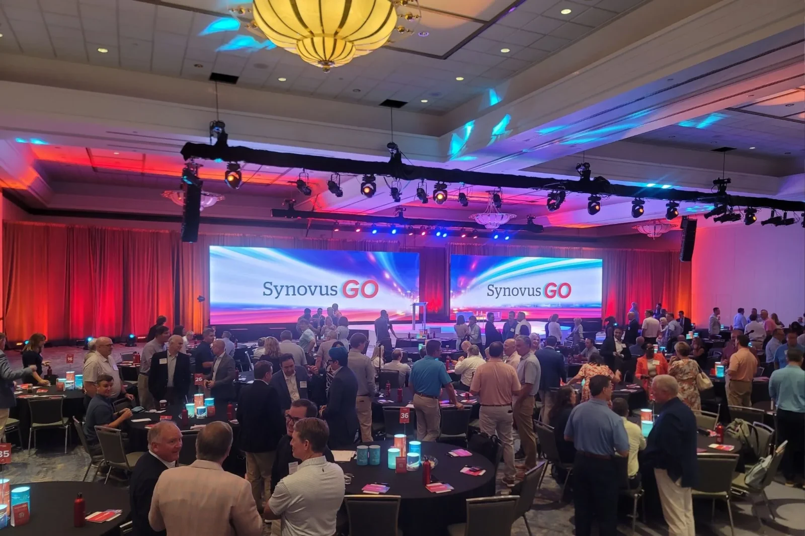 Corporate Conference Lighting and LED Stage Atlanta Wide ballroom view with LED stage, truss lighting, and audience environment for corporate event in Atlanta