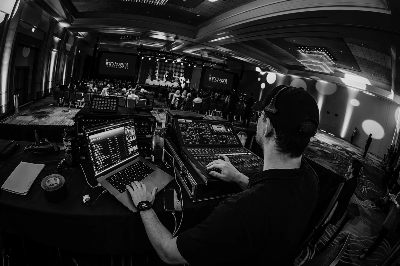 AV technician managing show control during a corporate conference event production