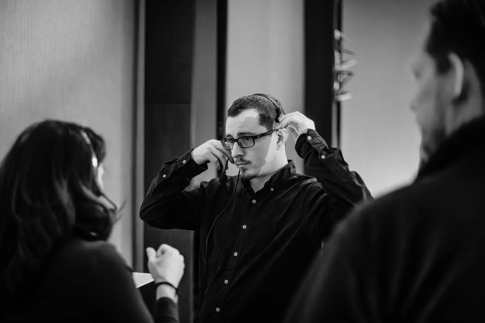 AV production show caller coordinating conference execution with headset