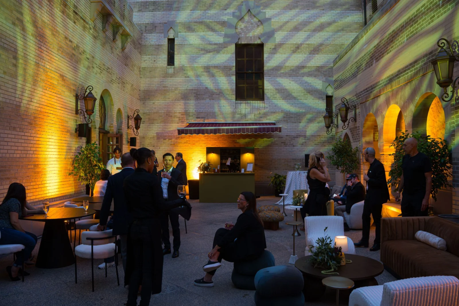 Fox Theatre Atlanta Corporate Event Lounge with Lighting and Projection Design Corporate event lounge setup at Fox Theatre Atlanta with ambient lighting design, projection textures, and multi-space guest experience