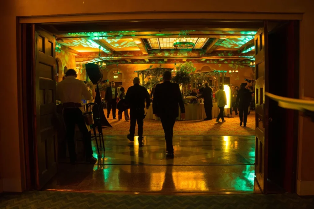 Guests entering a corporate event at Fox Theatre Atlanta with immersive lighting and event design