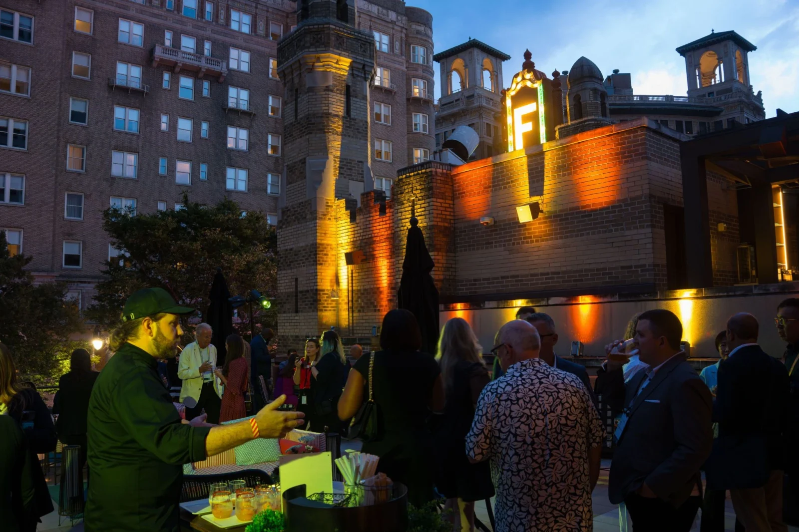Fox Theatre Atlanta Outdoor Corporate Event with Architectural Lighting Outdoor corporate reception at Fox Theatre Atlanta with architectural lighting design, branded environment, and guest networking