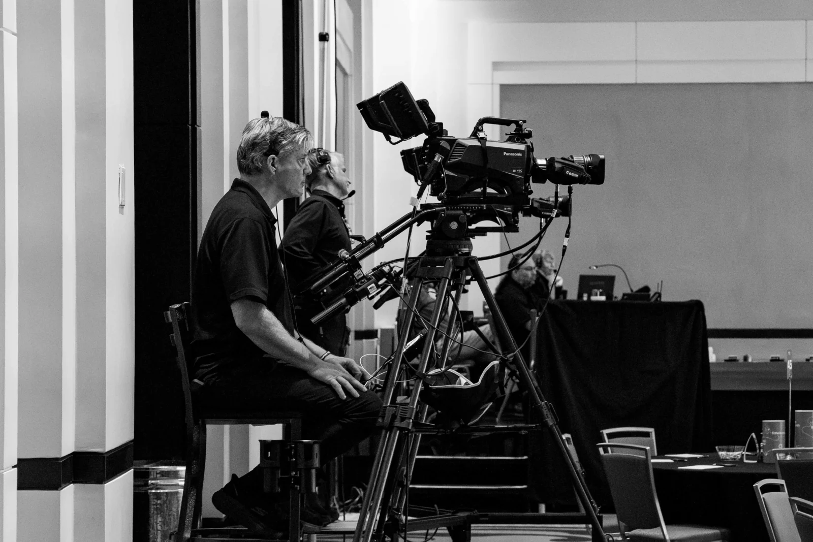 IMAG Camera Setup Atlanta AV Production IMAG camera setup for corporate event production in Atlanta with technician operating broadcast camera