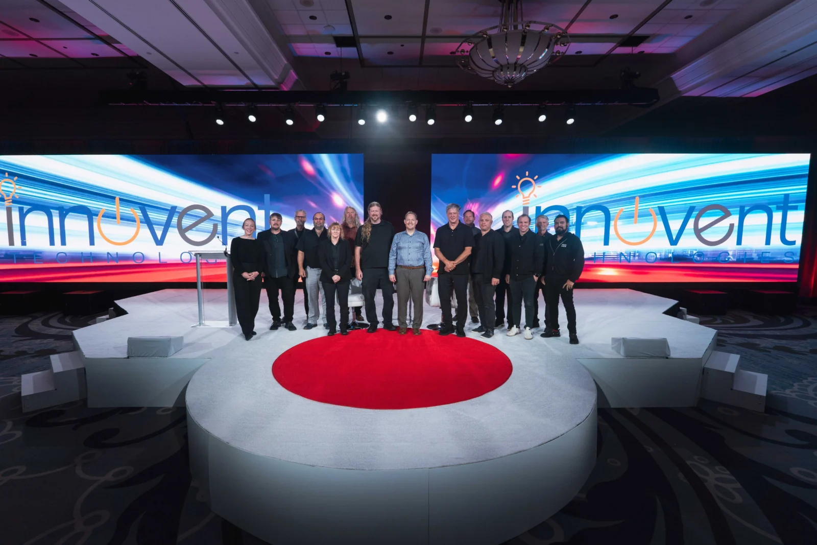 Innovent Technologies Team on Stage with LED Production Setup Innovent Technologies production team on stage with large LED screens and scenic staging at Cobb Galleria Centre in Atlanta