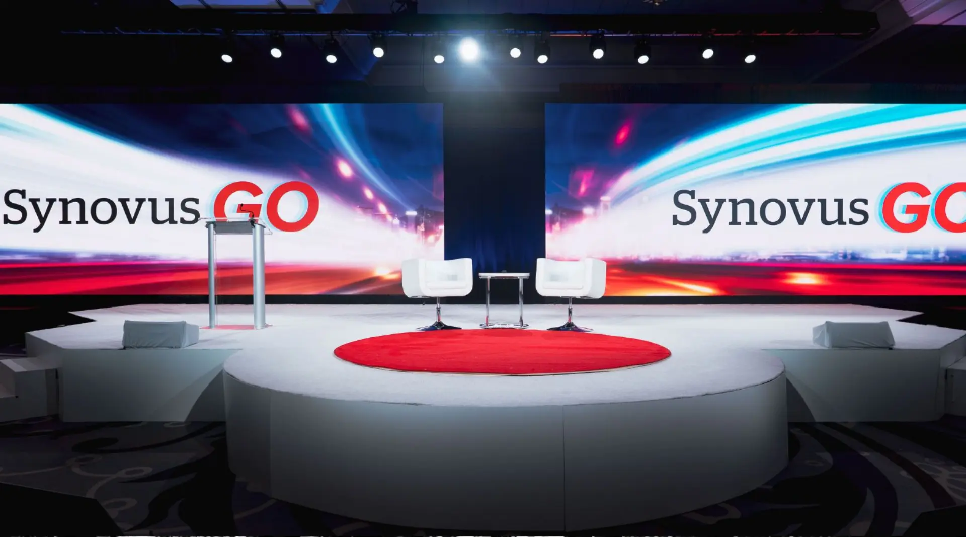 Circular Stage and LED Video Walls Atlanta AV Production Synovus executive meeting stage with circular platform and dual LED video walls in Atlanta