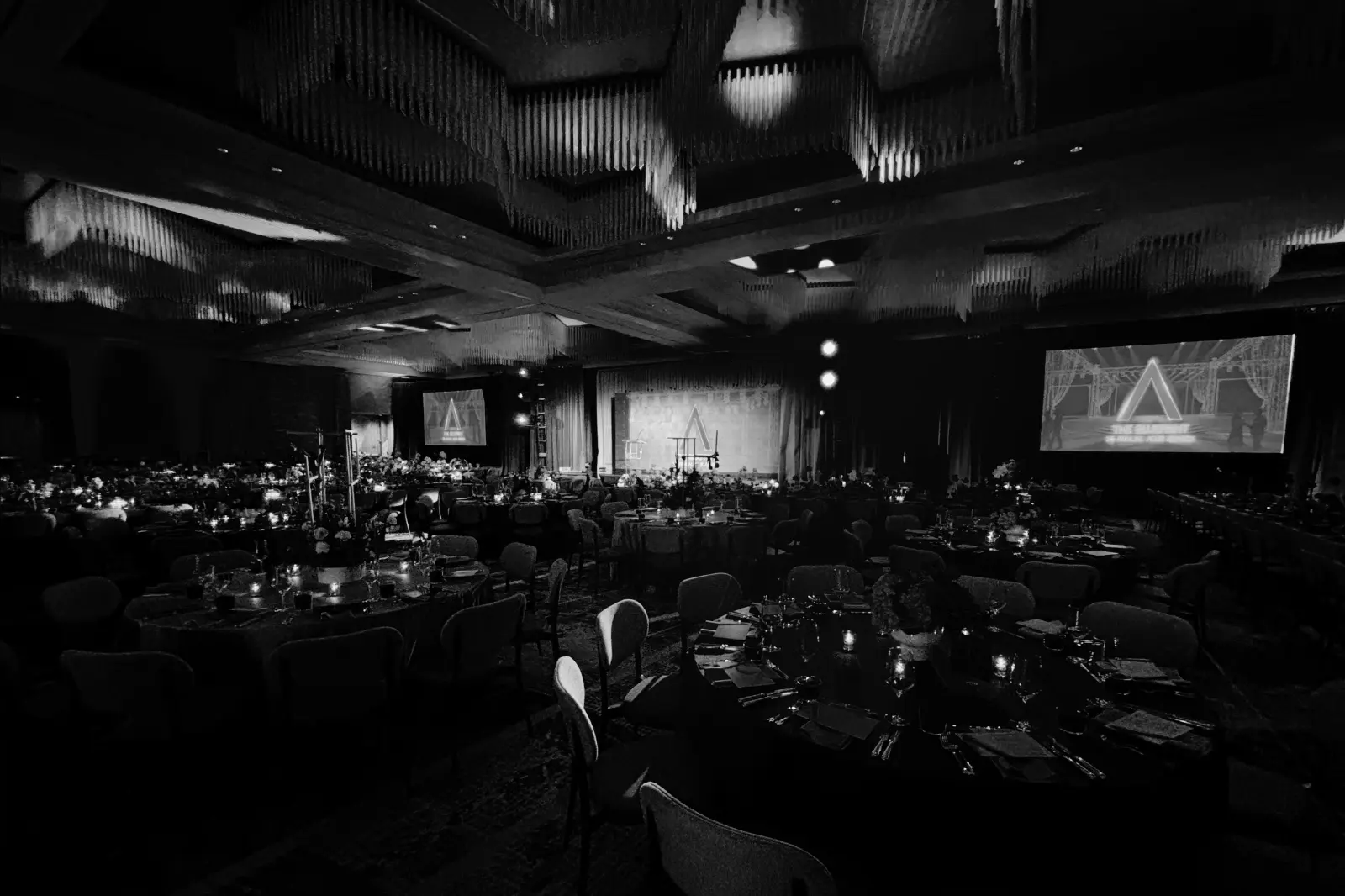 Wide ballroom view of the 2026 Allie Awards at Hotel Phoenix Atlanta featuring stage production, projection screens, lighting design, and banquet seating designed by Innovent Technologies.