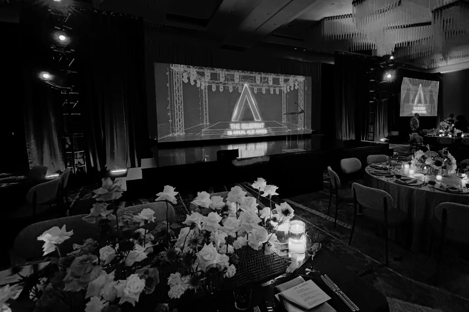 Stage and ballroom production setup for the 2026 Allie Awards at Hotel Phoenix Atlanta featuring large-format projection, stage lighting, and awards presentation environment by Innovent Technologies.