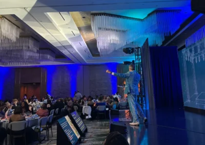 Live auction presentation during the 2026 Allie Awards featuring stage lighting, audience engagement, and AV production by Innovent Technologies in Atlanta