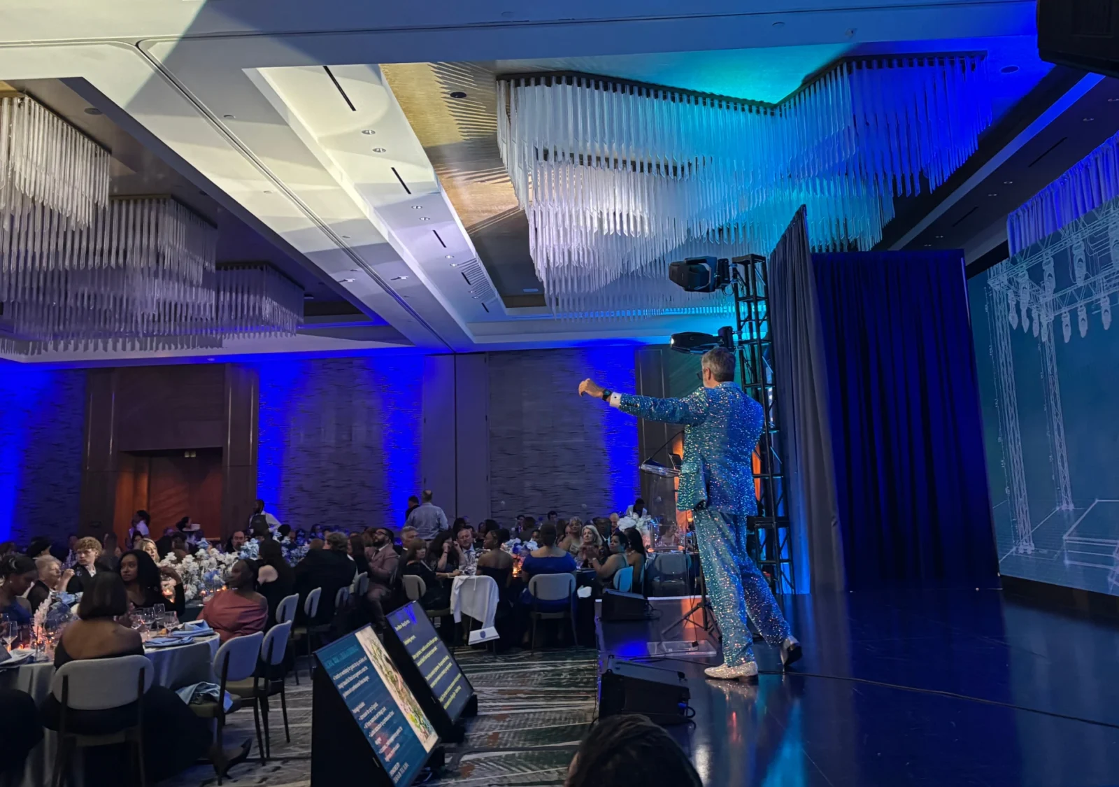 Live auction presentation during the 2026 Allie Awards featuring stage lighting, audience engagement, and AV production by Innovent Technologies in Atlanta