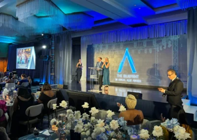 Presenters on stage during the 2026 Allie Awards with scenic staging, lighting, and AV production by Innovent Technologies in Atlanta