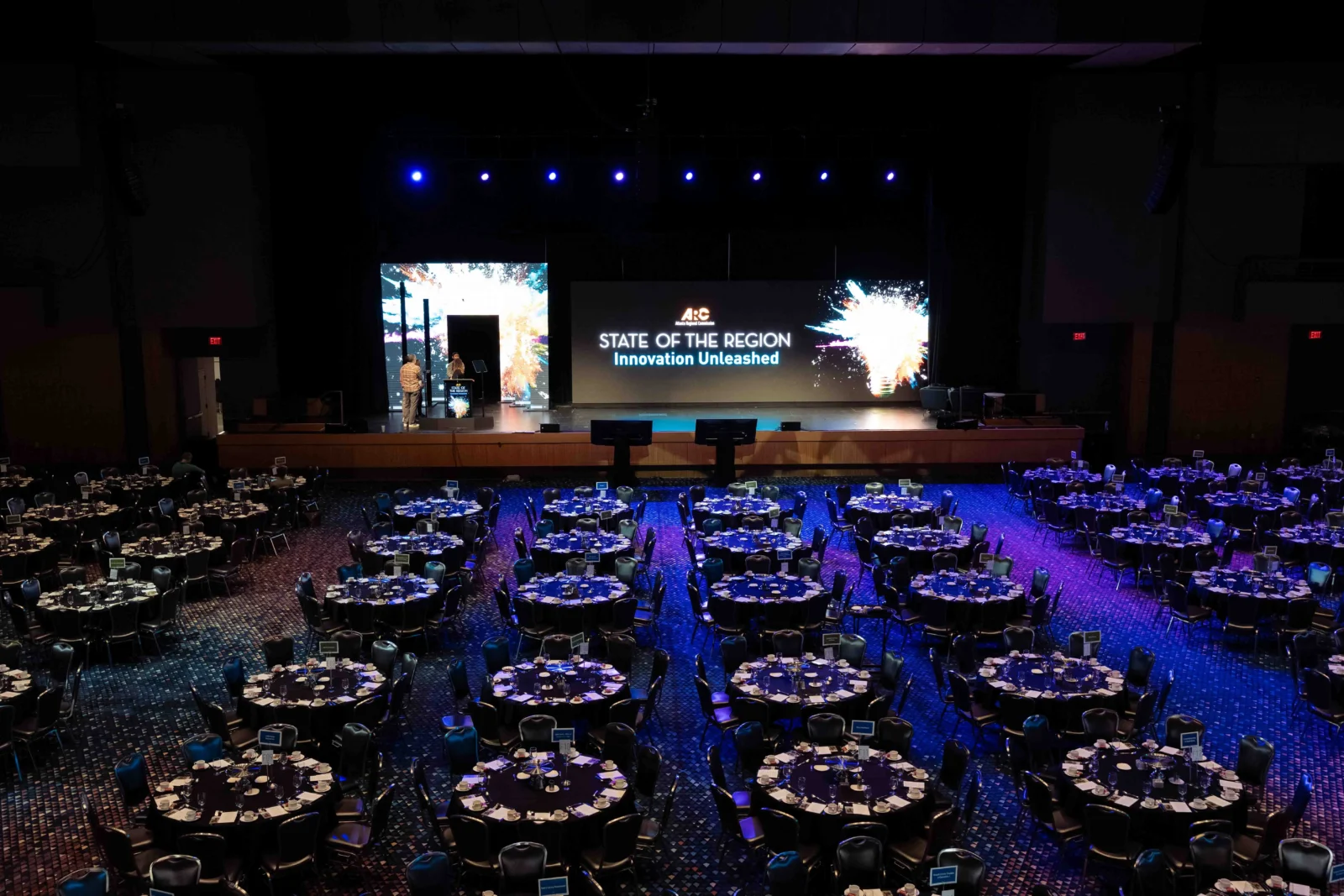 Wide ballroom setup with LED screens and stage production for the ARC State of the Region Breakfast at the Georgia World Congress Center