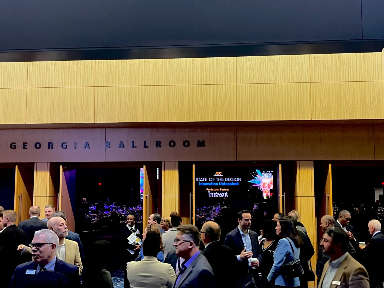 Attendees entering the Georgia Ballroom at the Georgia World Congress Center during the ARC State of the Region Breakfast produced by Innovent Technologies