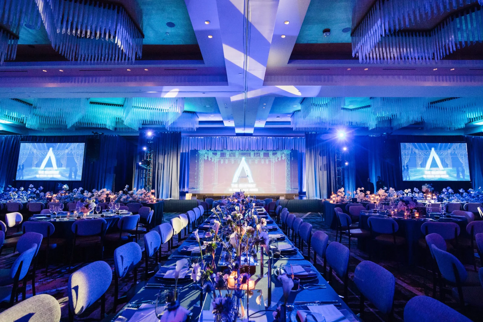 Corporate event stage design and AV production by Innovent Technologies at a large-scale gala event featuring projection, lighting, staging, and immersive ballroom production in Atlanta.