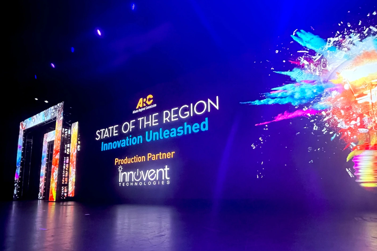 Conference stage with LED wall, lighting design, and event branding during live production in Atlanta