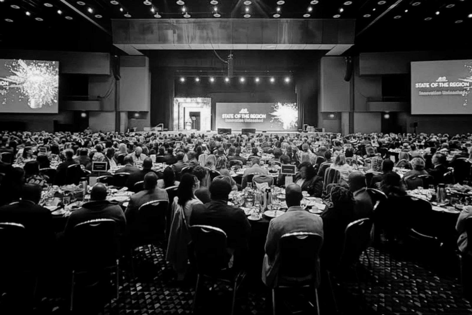 Large-scale conference AV production with general session stage, audience, lighting, and LED screens in Atlanta