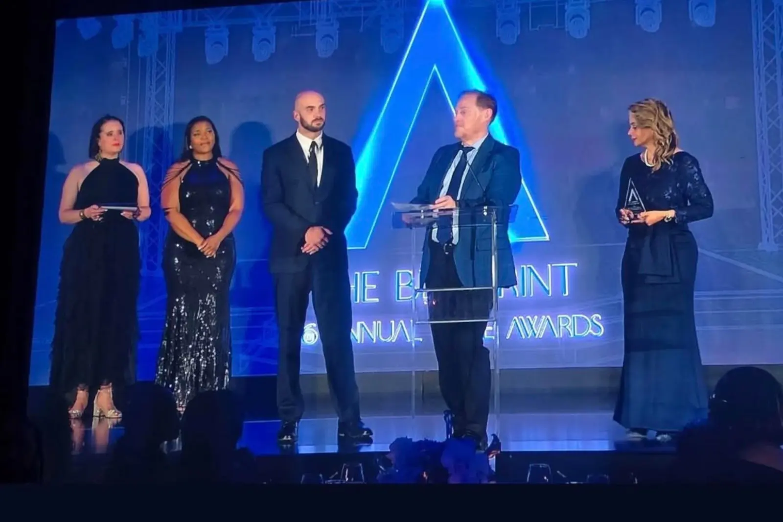 John Johnson and the Innovent Technologies team accepting the Best Staging and Rigging Design award at the 2026 Allie Awards in Atlanta.