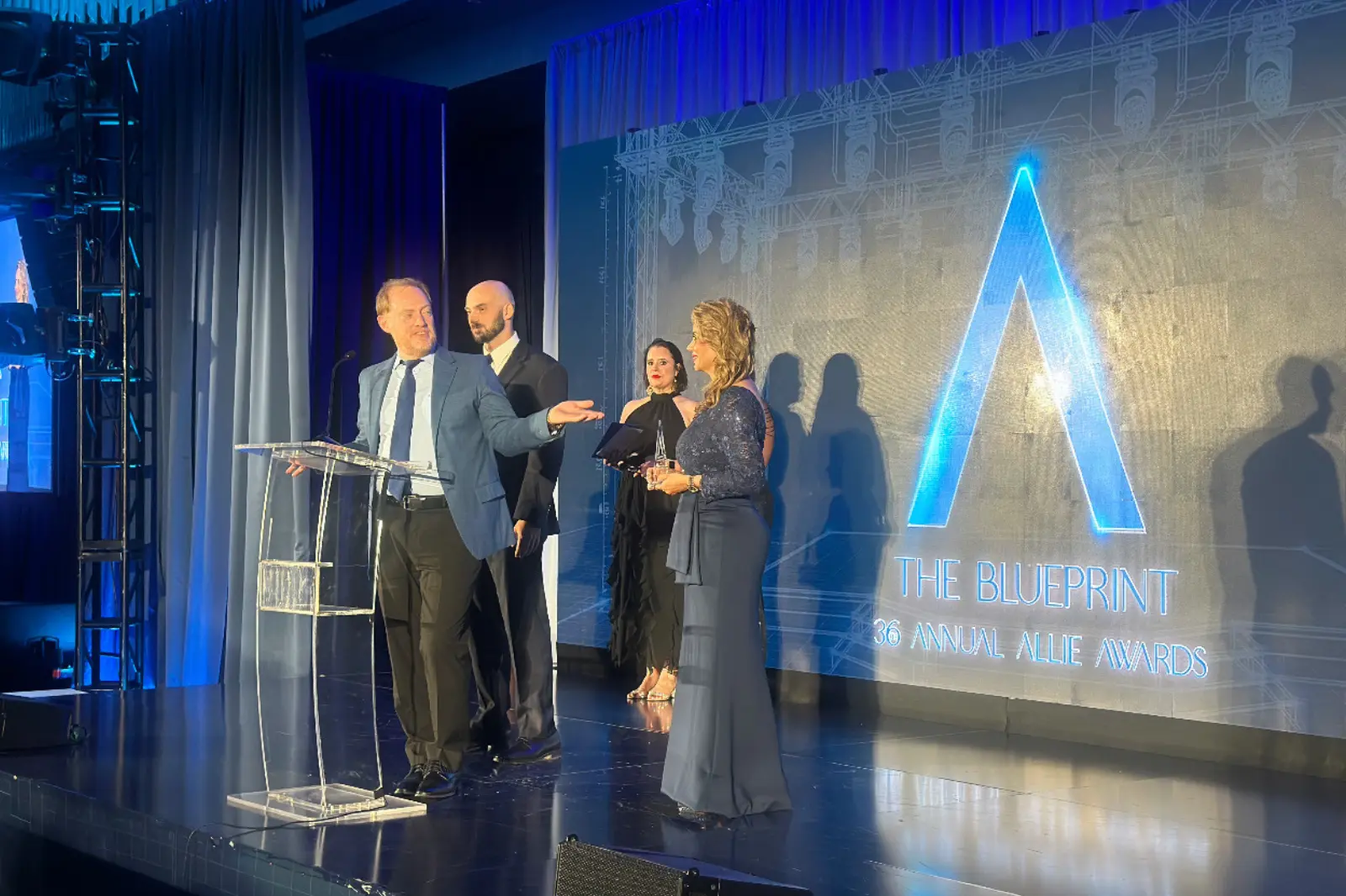 Innovent Technologies team on stage during the 2026 Allie Awards at Hotel Phoenix Atlanta after receiving recognition for live event production.