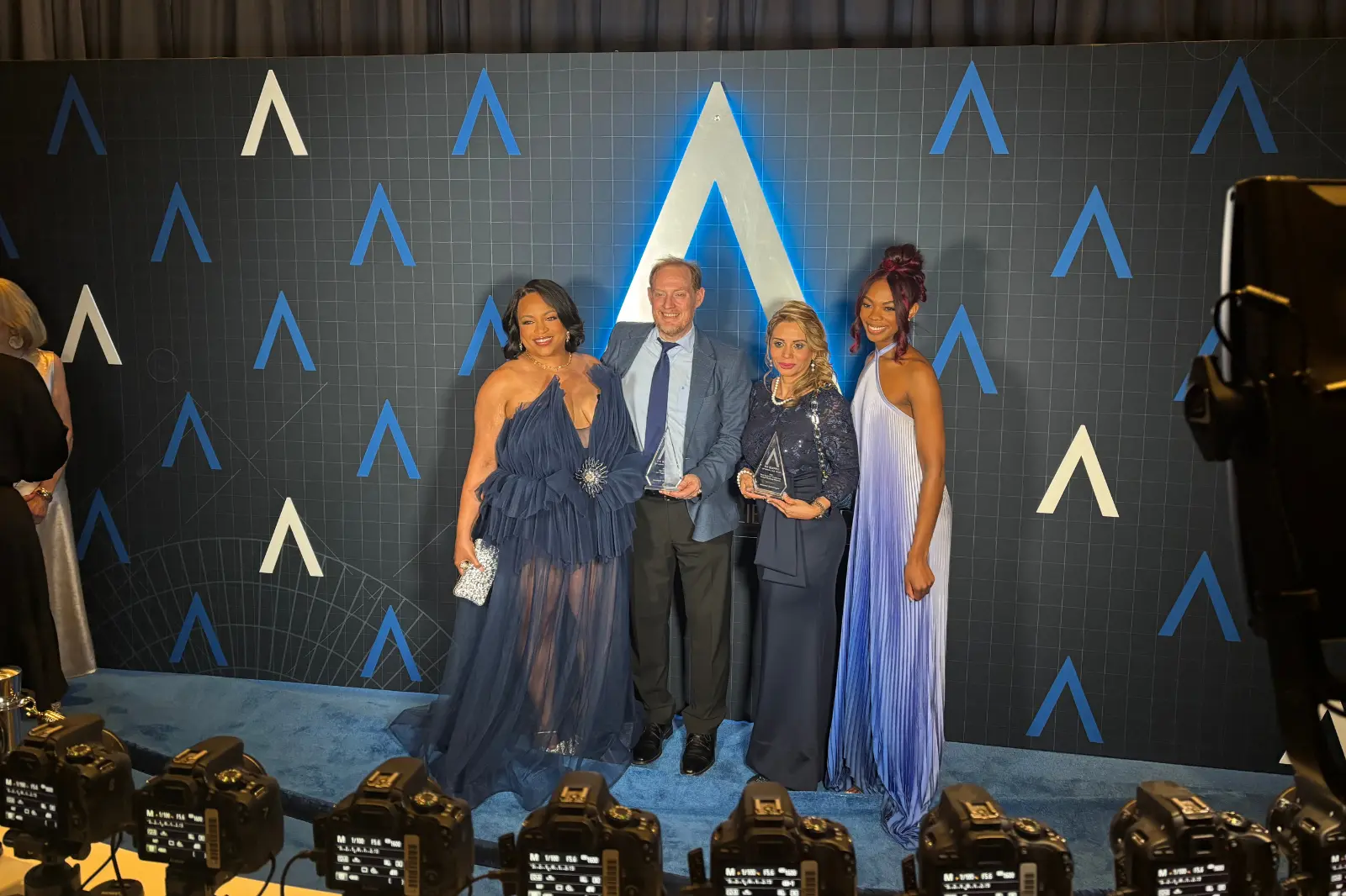 Innovent Technologies team posing with awards at the 2026 Allie Awards in Atlanta.