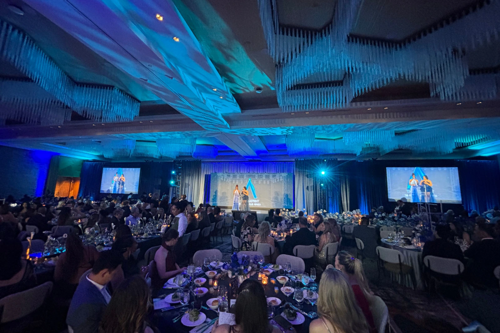 Audience view of the 2026 Allie Awards at Hotel Phoenix Atlanta featuring stage lighting, projection, and live event production supported by Innovent Technologies