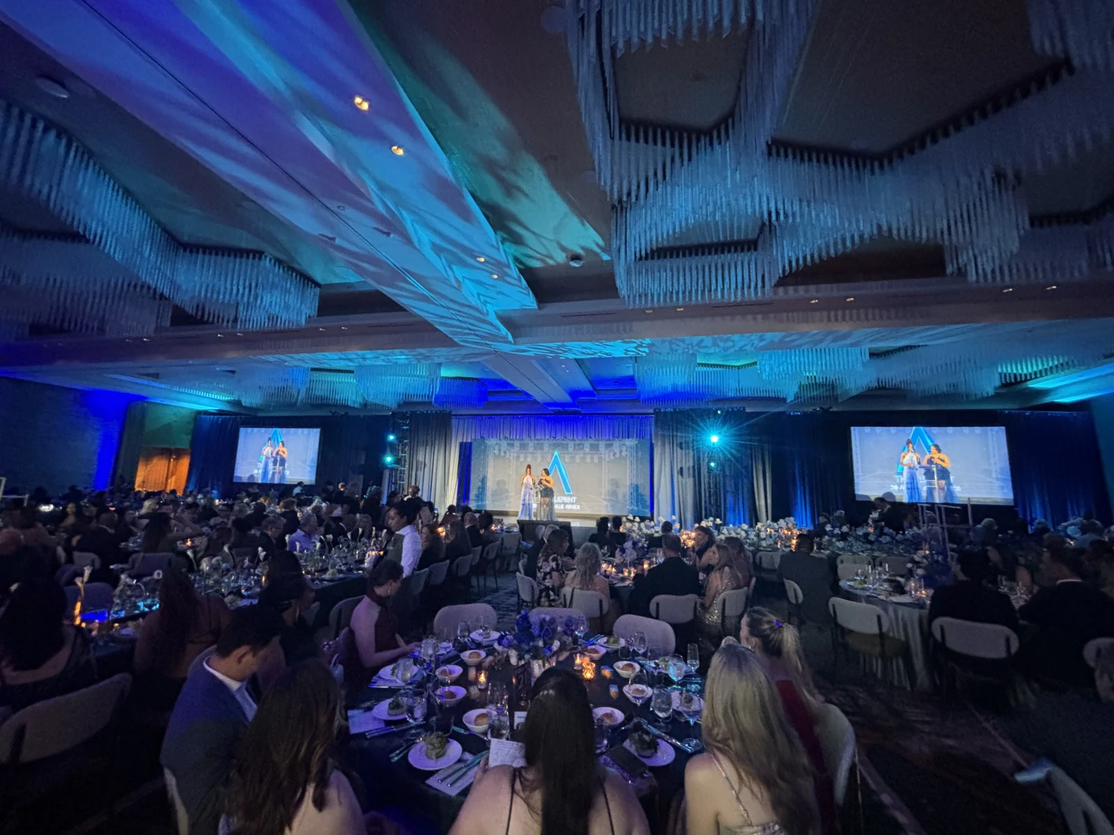 Audience view of the 2026 Allie Awards at Hotel Phoenix Atlanta featuring stage lighting, projection, and live event production supported by Innovent Technologies
