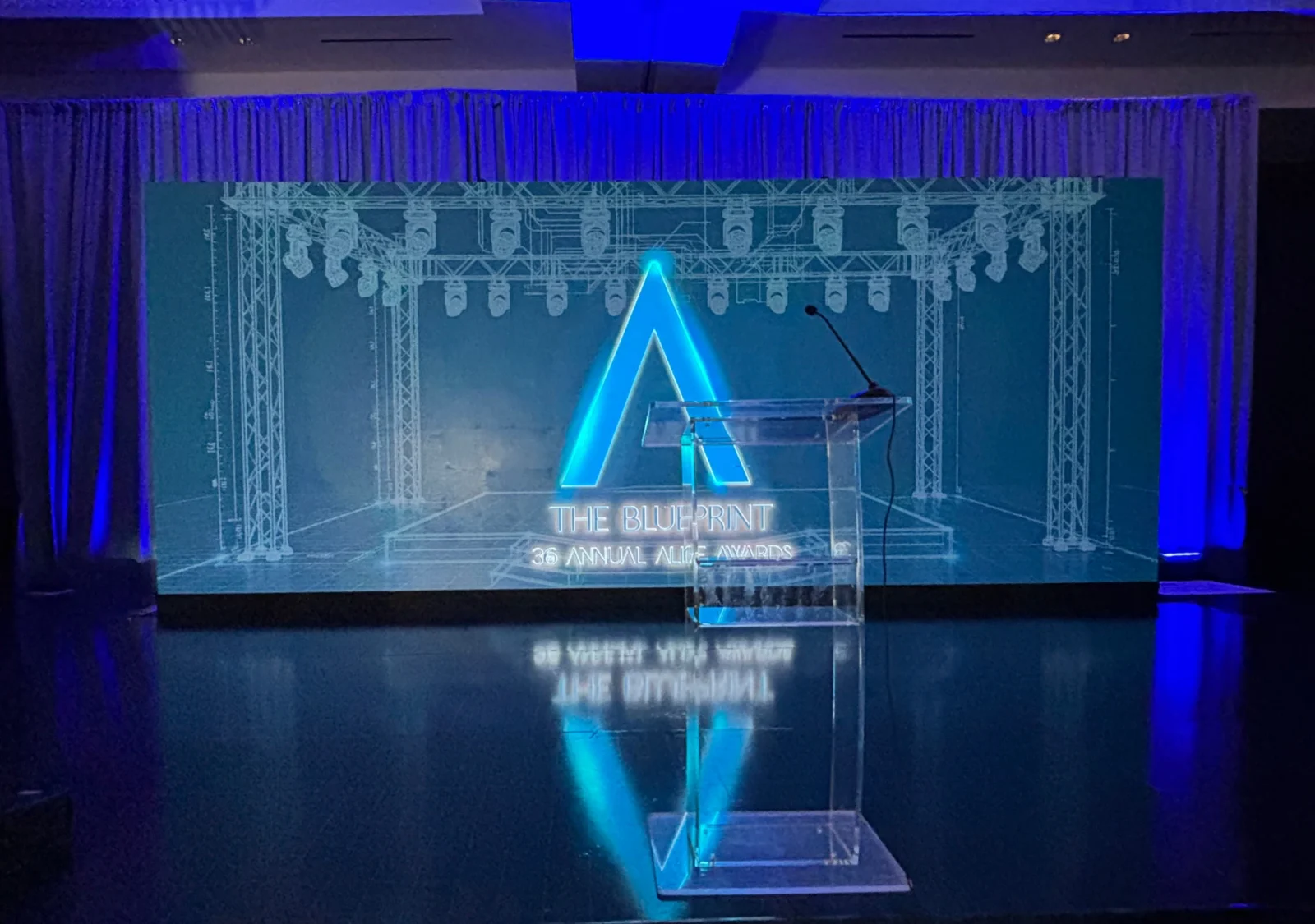 Blueprint-themed stage design produced by Innovent Technologies for the 2026 Allie Awards in Atlanta