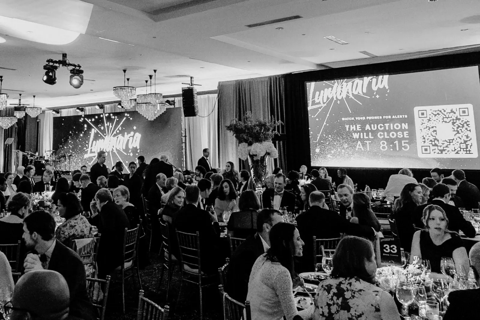 Corporate conference featuring presentation screens, attendee engagement technology, audiovisual production, and event systems supported by hotel internet and Wi-Fi.