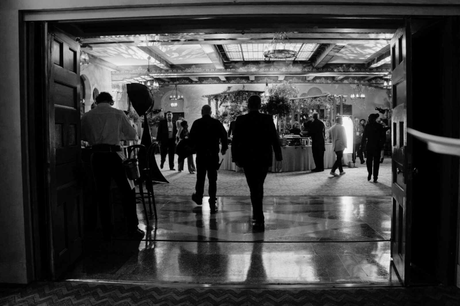 Guests entering a conference event environment with lighting design and AV production by Innovent Technologies