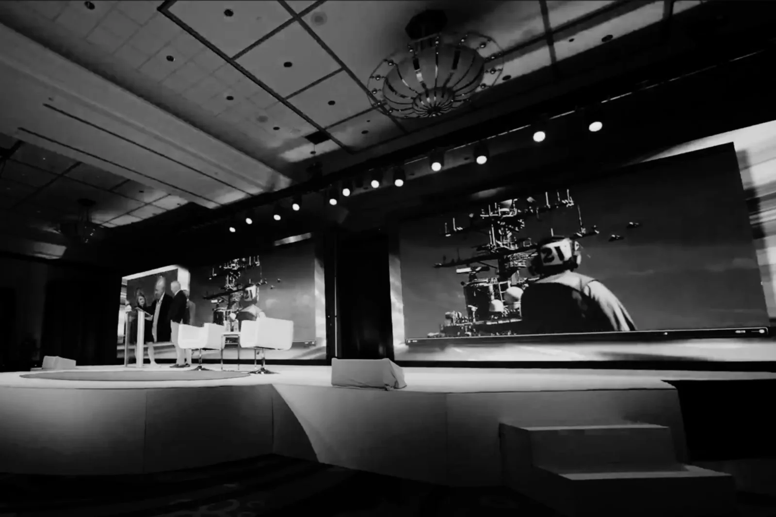 Conference AV production with LED video screens, stage lighting, and live event technology