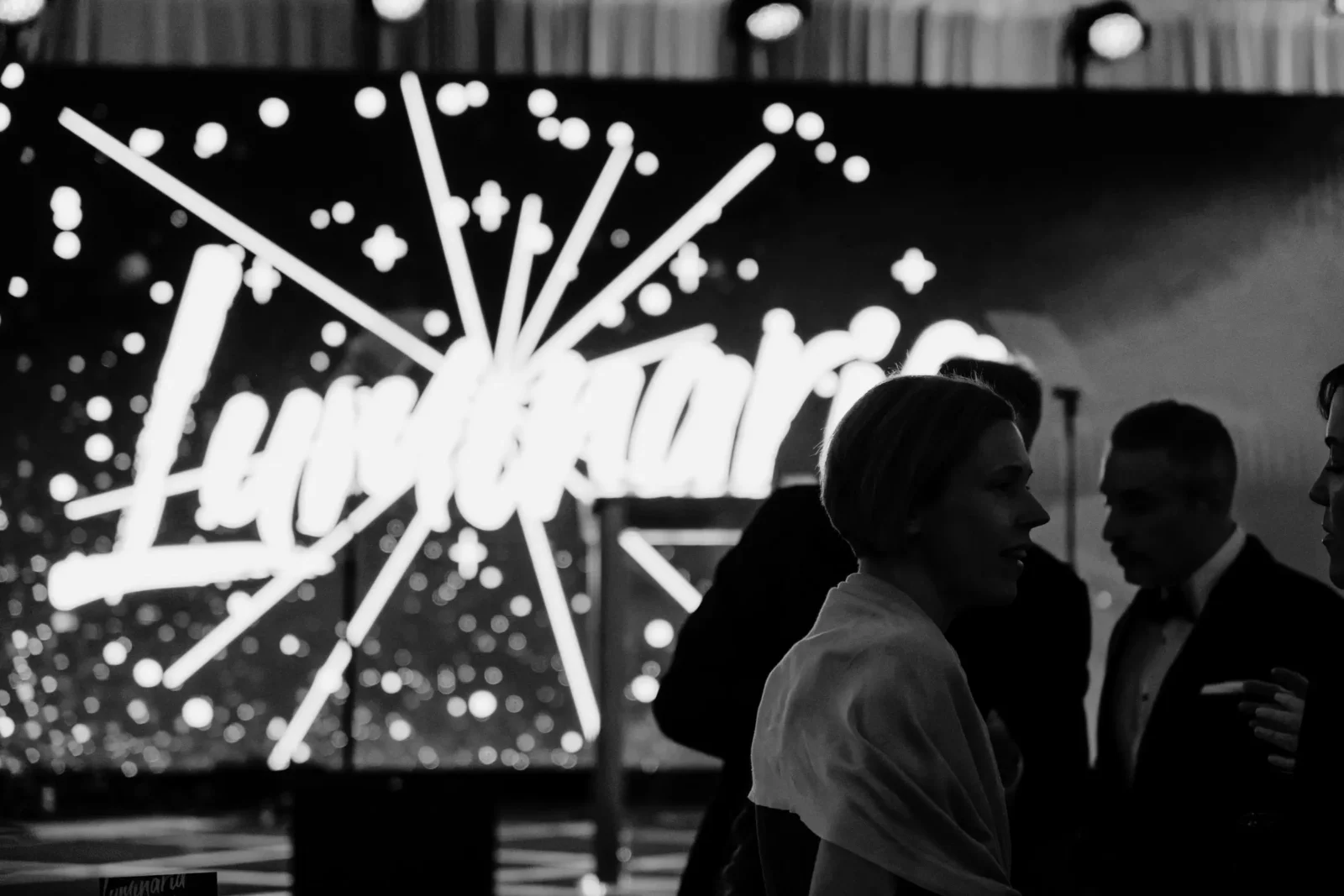 Guests at Piedmont Healthcare’s Luminaria Gala with illuminated event branding and production design.