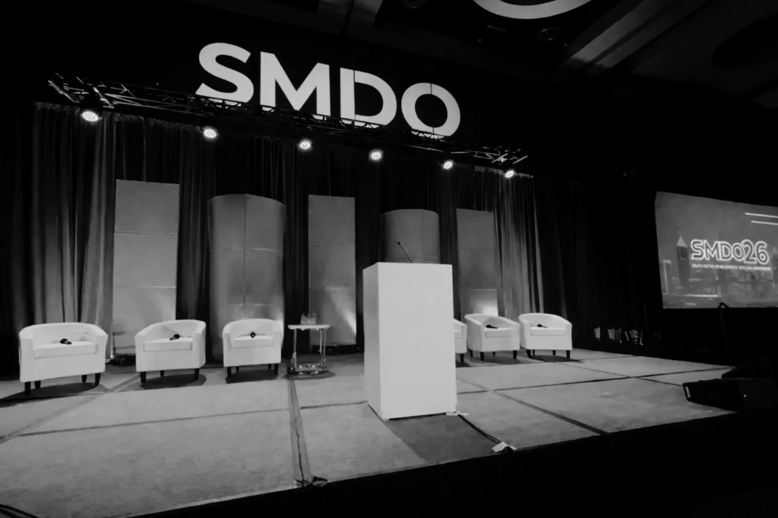 South Metro Development Outlook stage production at Georgia International Convention Center with projection screens and panel setup